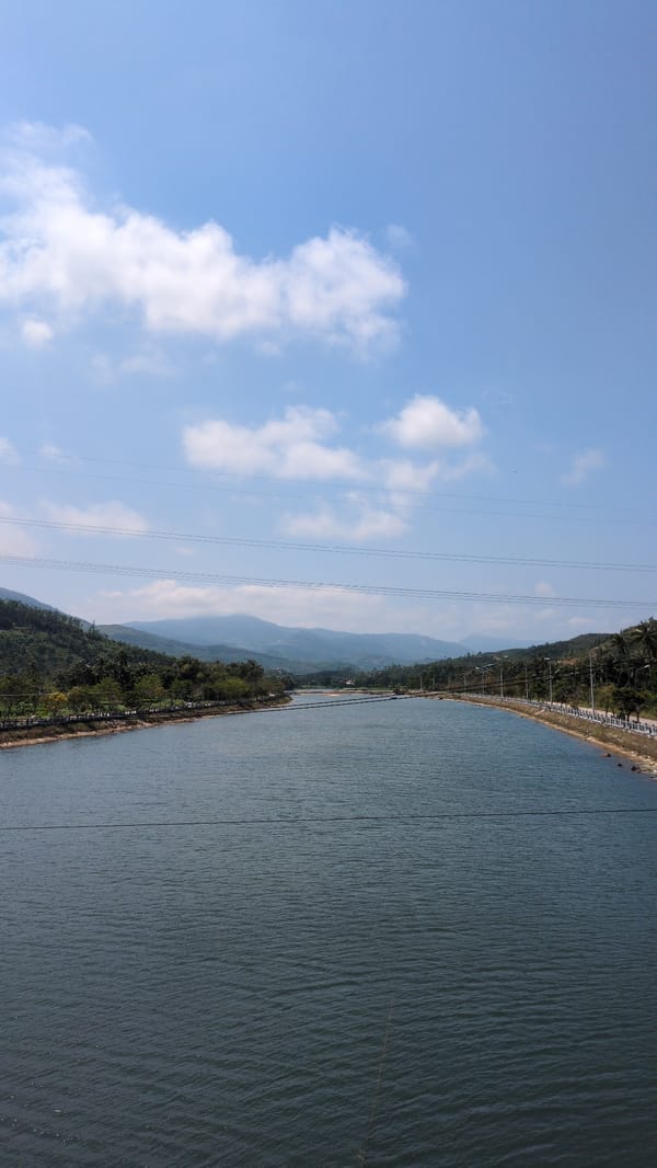 Morning waterway view with power lines in Song Cau