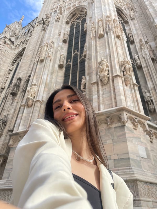 Tourist takes selfies at Milan Cathedral during afternoon visit