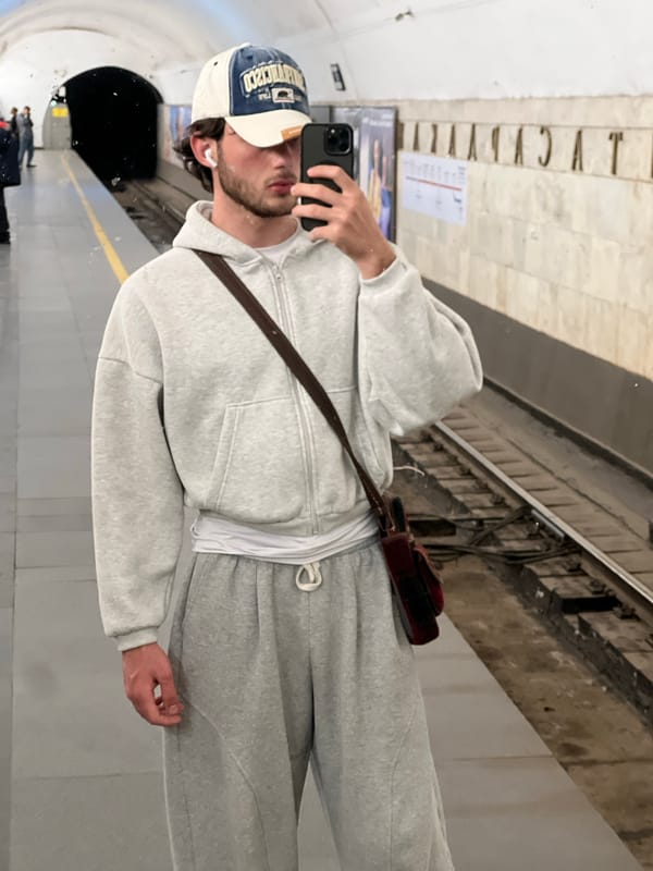 Man takes selfie using reflections in Yerevan Metro station