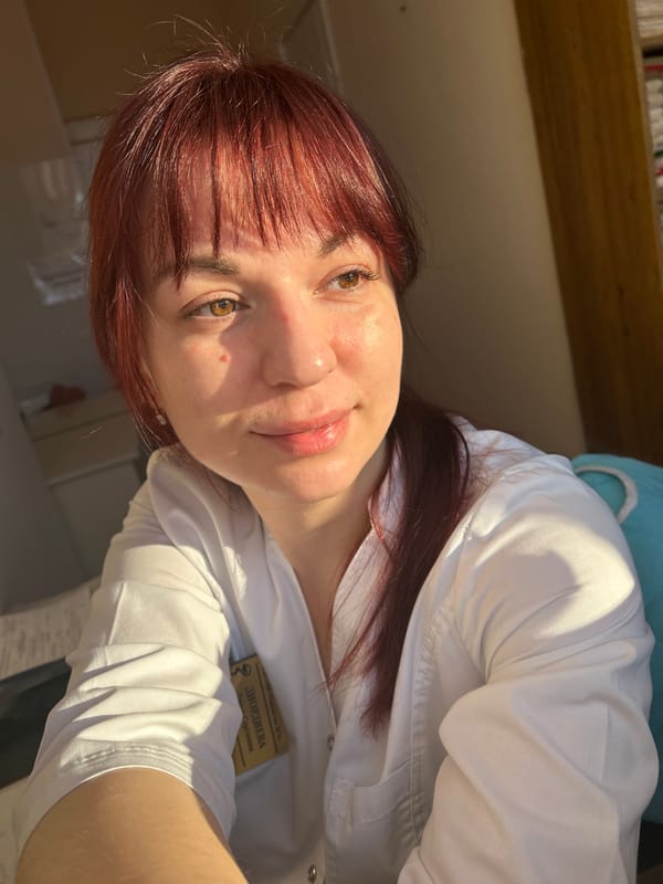 Healthcare worker photographed in lab coat in Фоки, Russia