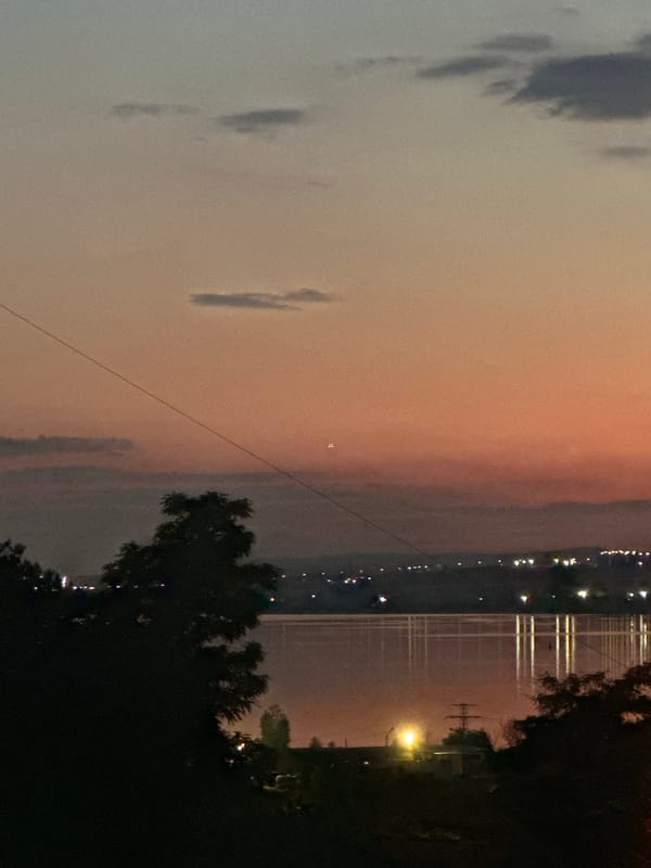 A summer day winds down across Varna, sky to shoreline.