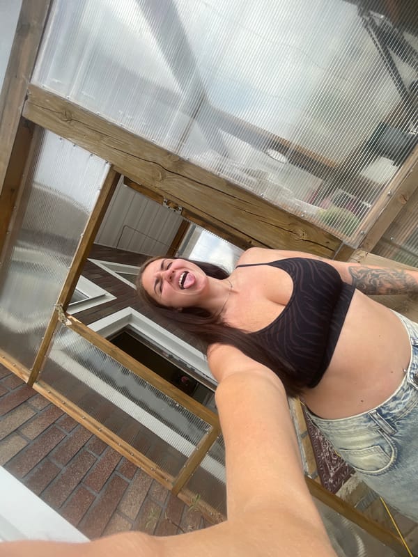 Casual selfie session at a greenhouse location outside Moscow