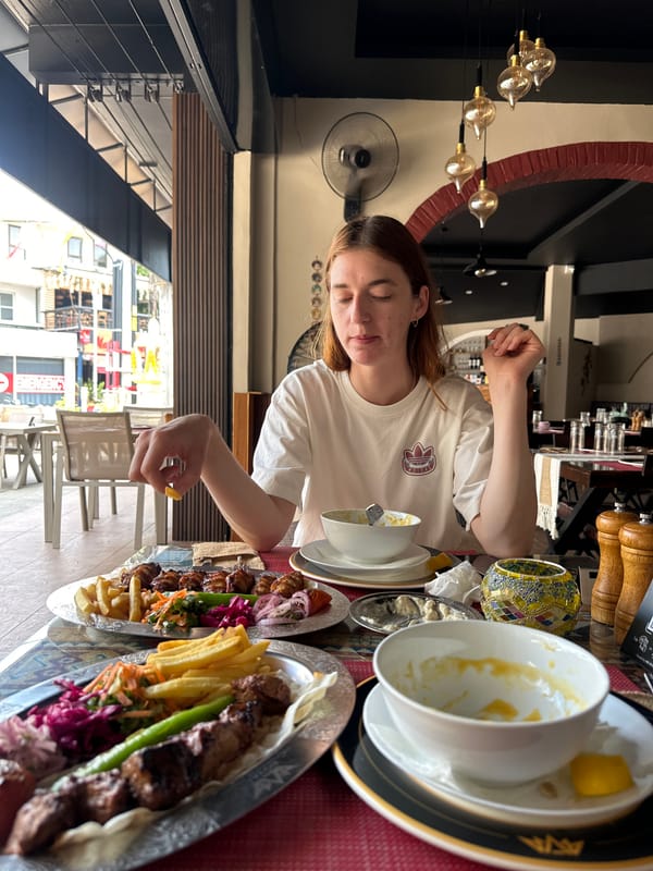 Woman dines at restaurant in Baan Chaweng, Thailand