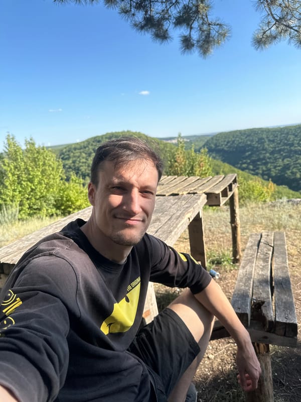 Hilltop bench stop with forest views near Humentsi, Ukraine