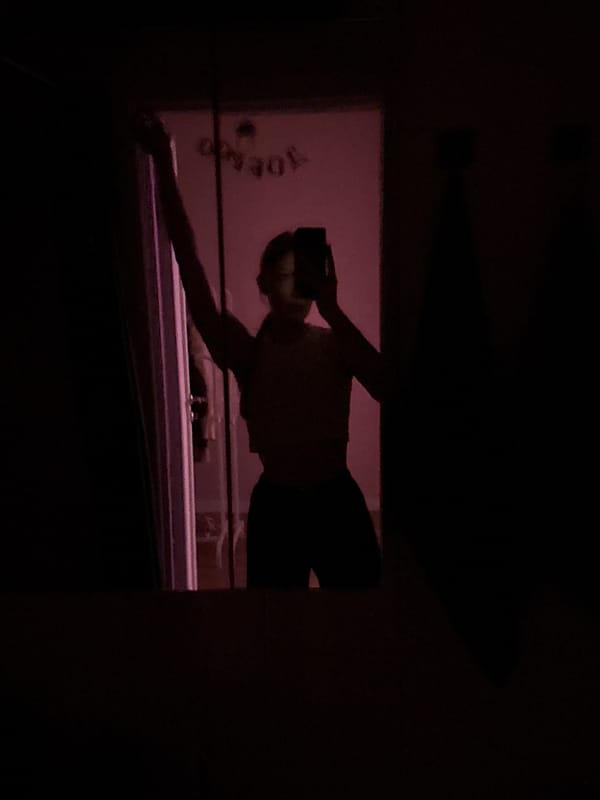 Woman takes bathroom mirror selfies in Perm, Russia