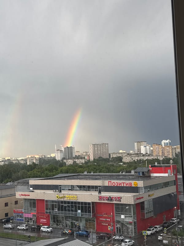Rainy afternoon with rainbow, peonies captured in Perm apartment