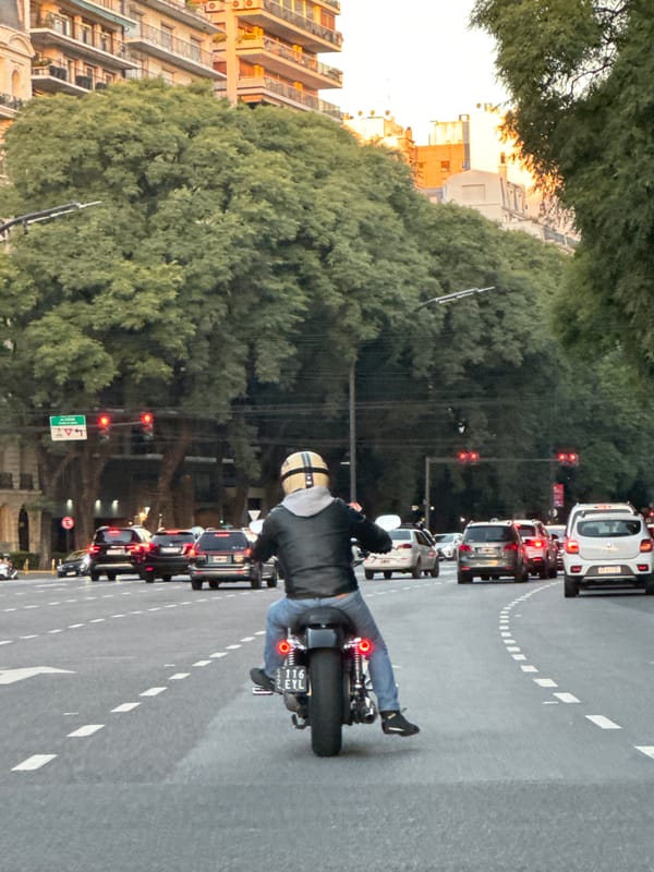 Evening traffic stops at Buenos Aires crosswalk during rush hour