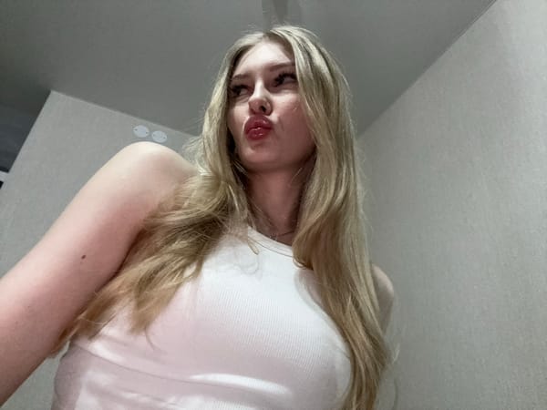 Woman takes creative selfies indoors in Perm, Russia