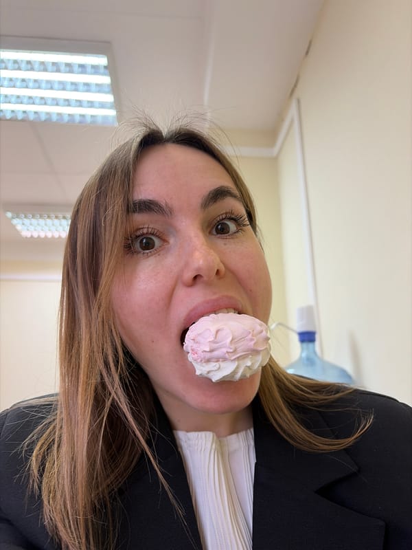 Woman poses with meringue treats in Izhevsk candy shop