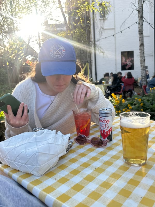 Woman enjoys afternoon break in London garden setting