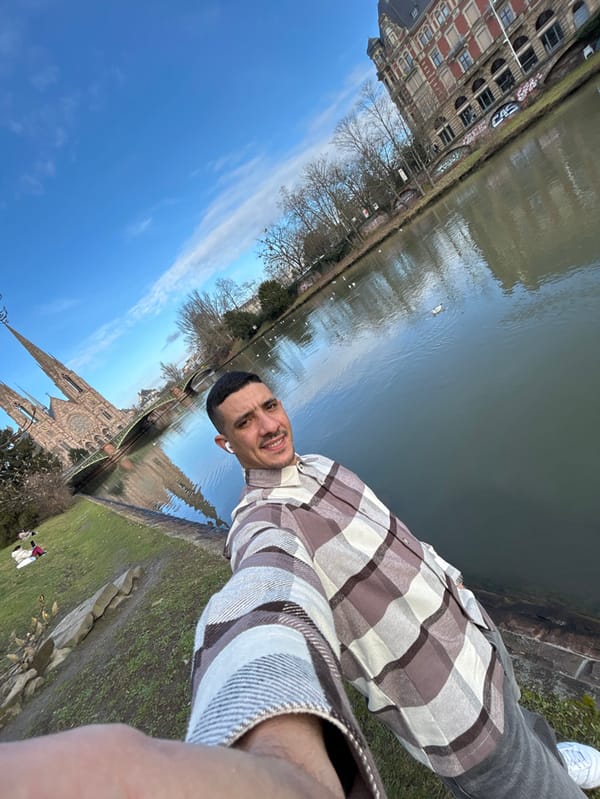 Tourist documents solo walking tour through historic Strasbourg landmarks
