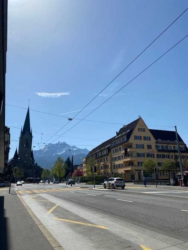 Street scene captured in Lucerne with mountain backdrop