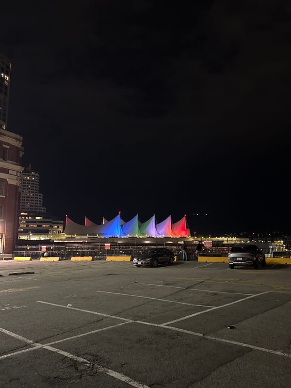 Nighttime walk documents Vancouver's illuminated downtown and active container port