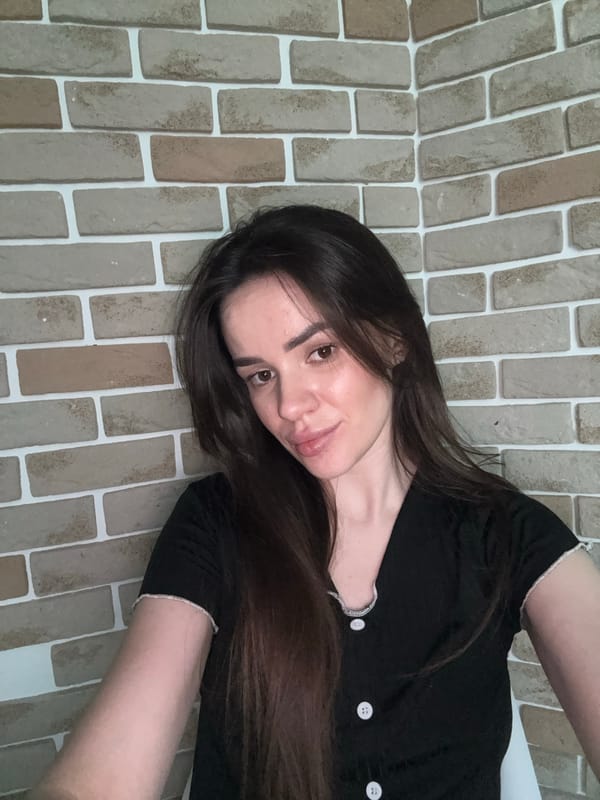 Quick selfie session against a brick wall indoors