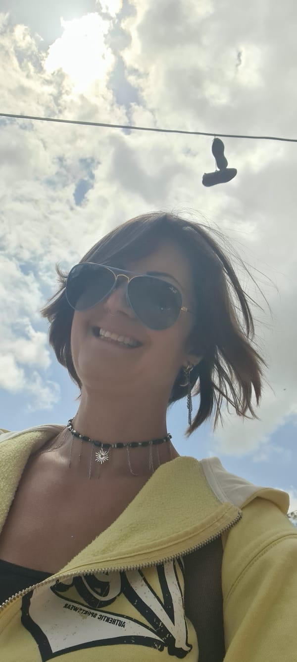 Woman photographed outdoors in yellow hoodie, Lachish Regional Council