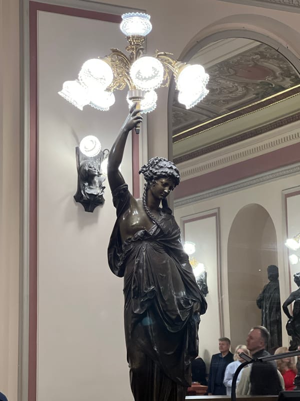 Tourist captures Saint Petersburg Philharmonia interior and river tour boat