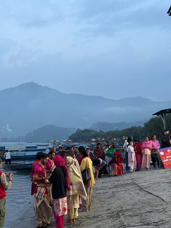 Boating activity captured on misty lake in Pokhara, Nepal