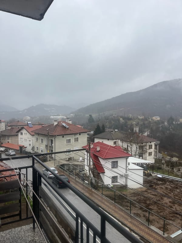 Foggy conditions obscure mountains over Bulgarian residential area