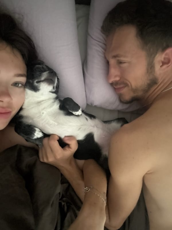 Couple shares morning moment with dog during Tel Aviv fog