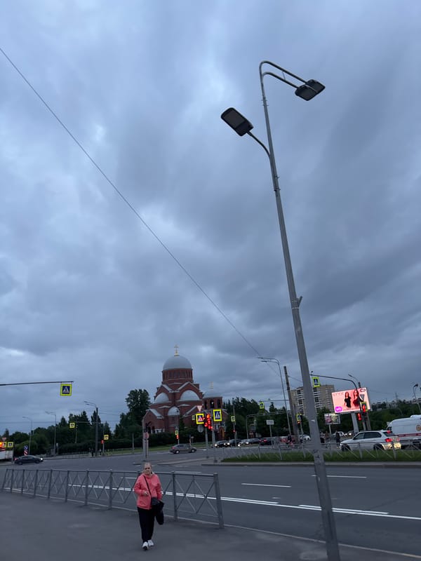 Woman photographed walking near Orthodox church and Russian flower shop