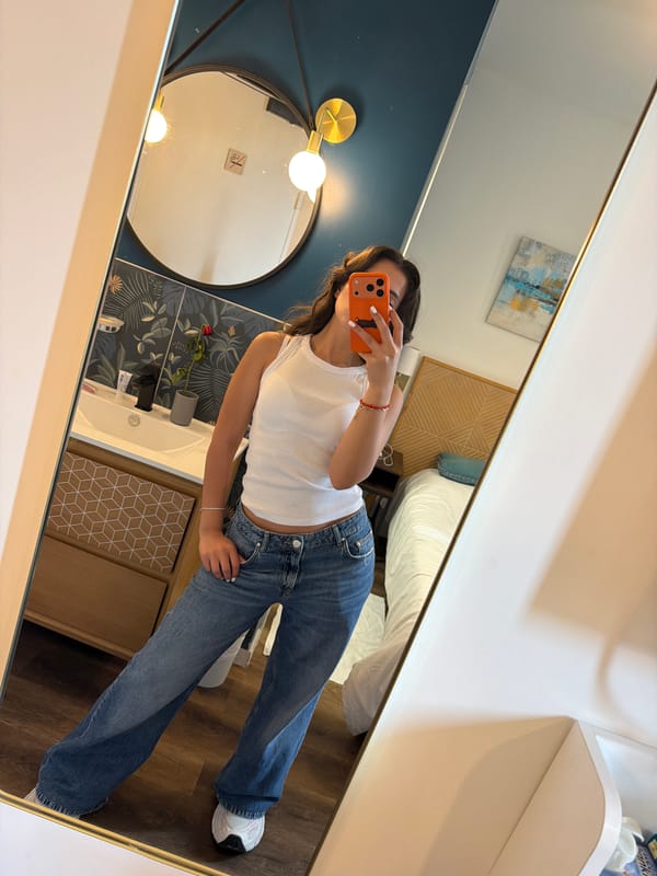 Woman takes morning mirror selfies in Cannes hotel room