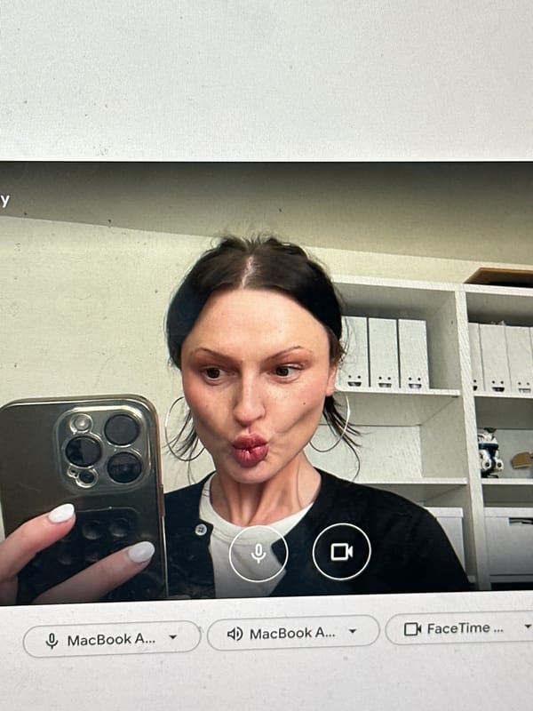 Woman takes selfie while on video call