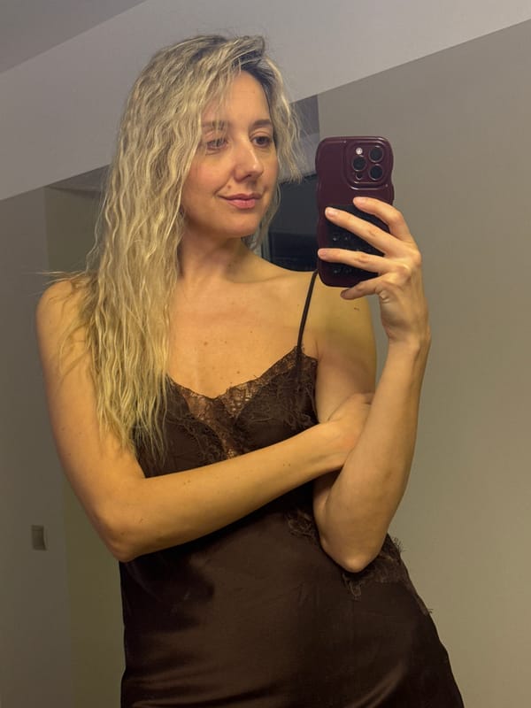 Woman takes multiple selfies indoors in Carnikava, Latvia