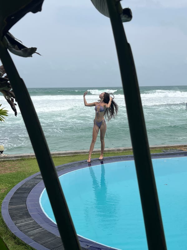 Woman poses poolside in lavender bikini in Goviyapana, Sri Lanka