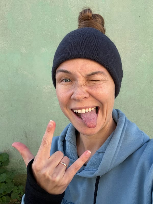 Woman makes playful face in Florianópolis street moment