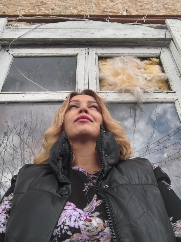 Mother and child photographed in rustic home interior, Noviy Russia