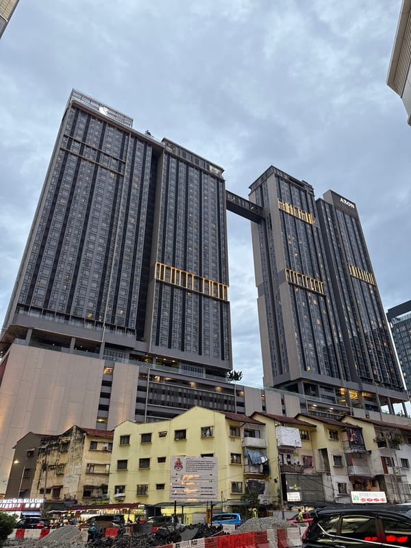 AXON-branded towers with sky bridge observed in Kuala Lumpur
