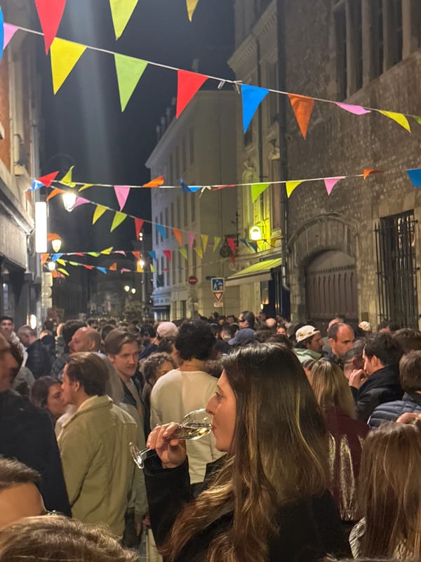 Night street celebration with champagne draws crowds in Reims