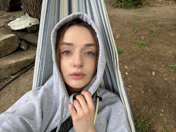 Young woman relaxes in hammock during outdoor break in Serbia