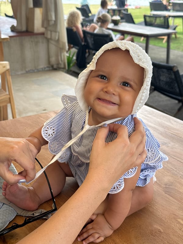 Baby and bandana dog at a Bali beachfront hangout