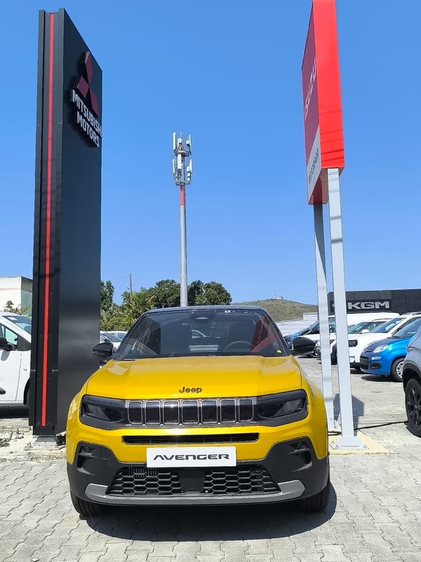Yellow Jeep Avenger on display at a Palmela dealership