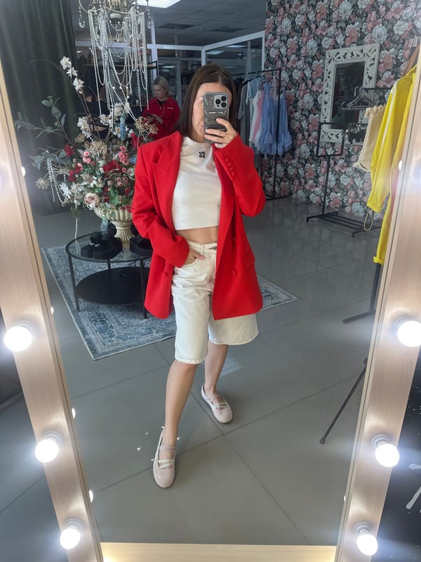 Woman takes mirror selfies in Votkinsk boutique