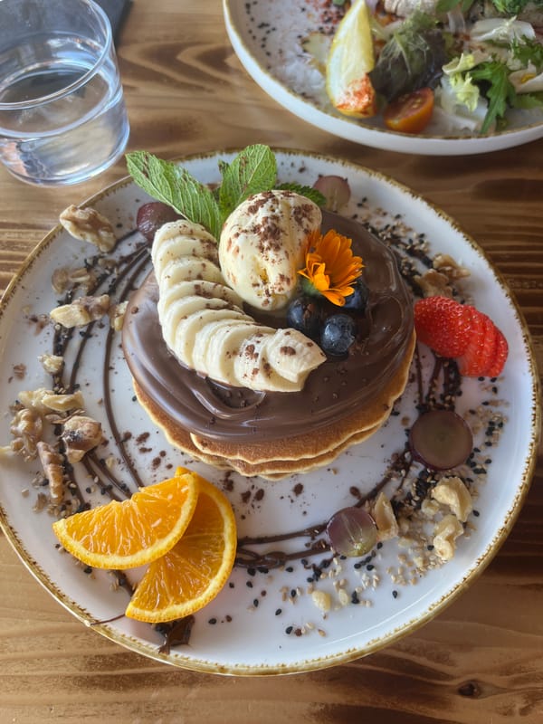 Elaborate fruit-topped chocolate pancakes photographed in Alicante