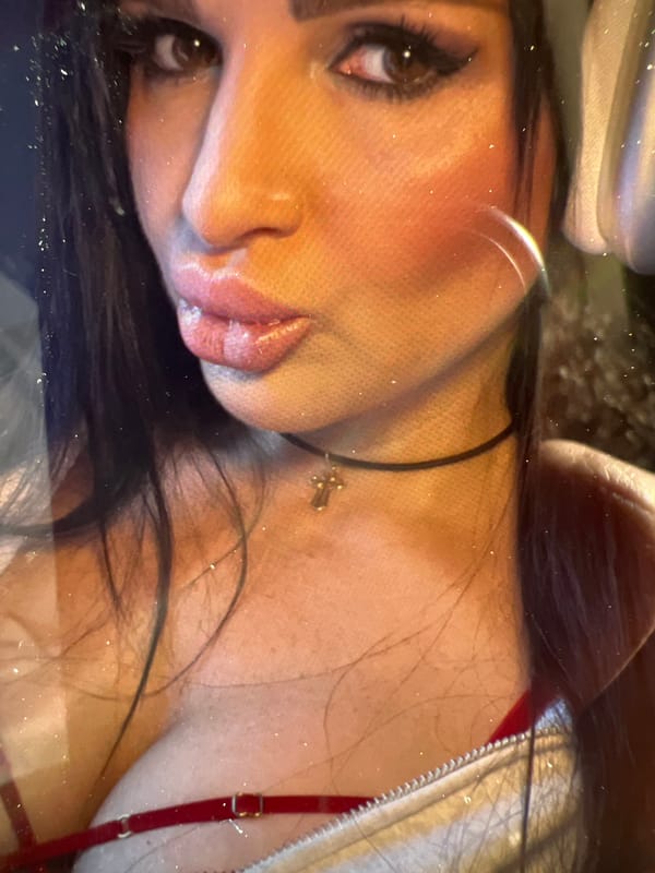 Young adults take selfies on Bischheim street