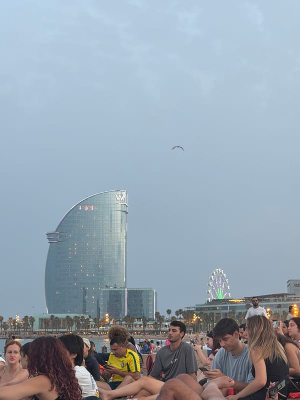 Barcelona waterfront at dusk, W Hotel cutting the skyline