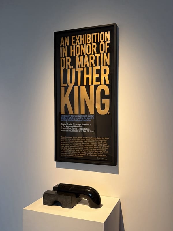 Museum visitor documents sculptures in New York gallery