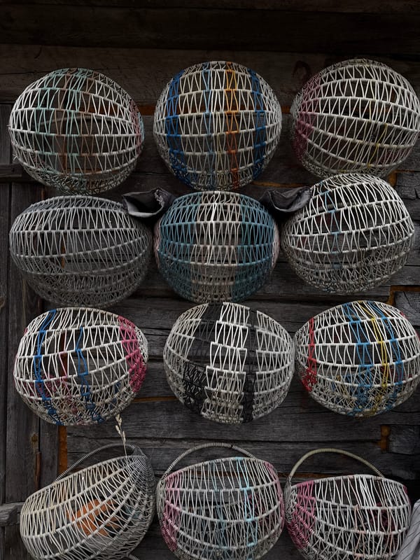 Traditional wicker baskets displayed in rural Belarus marketplace