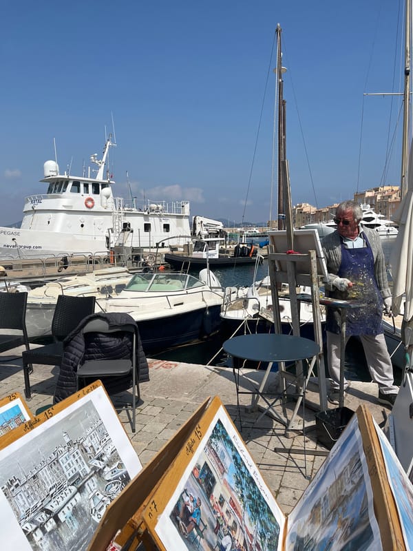Tourist takes selfie at Saint-Tropez shop window