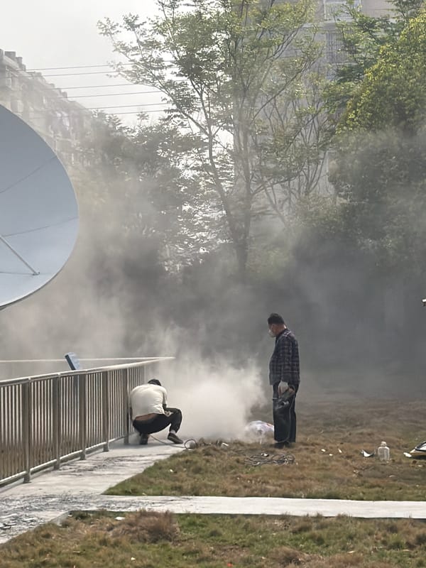 Workers conduct power tool maintenance on Jiangning District street
