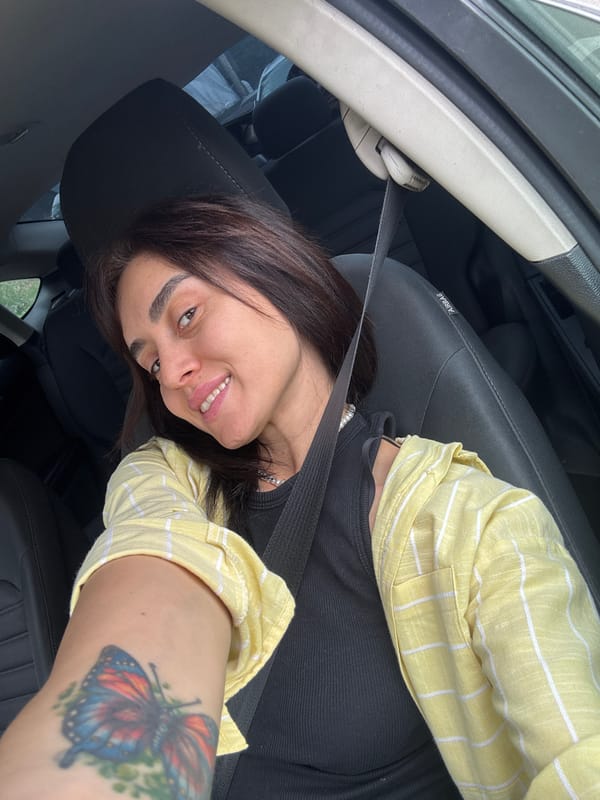 Car selfies on a Tbilisi street, mid-morning.
