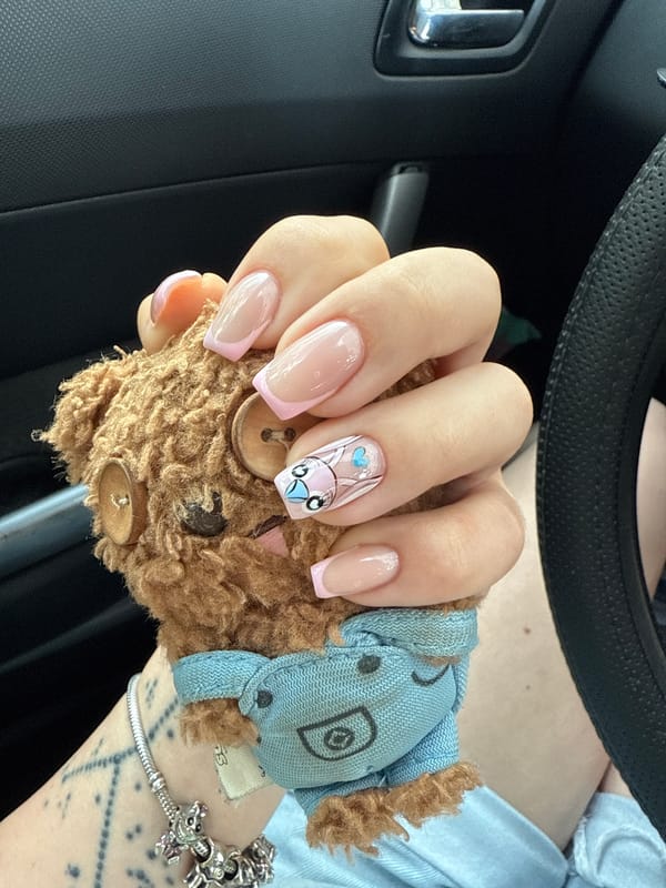 Person shows off new manicure with teddy bear in Bulgaria
