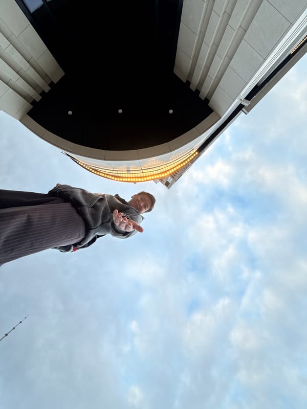 Hand reaches toward camera outside Moscow's NCCA