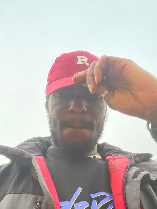 Man in red cap photographed in Jos, Nigeria