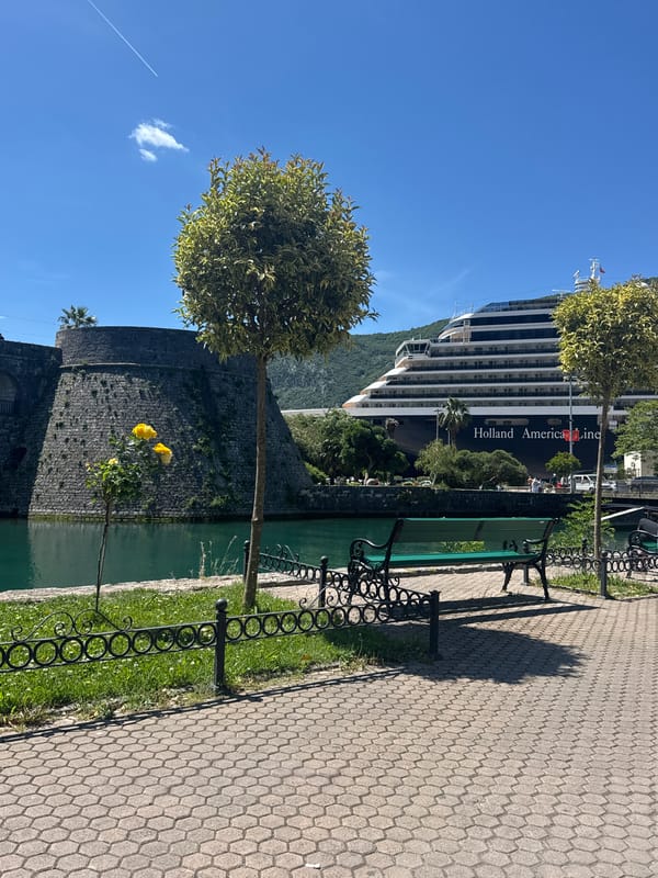 Cruise ship docks in historic Kotor Montenegro harbor