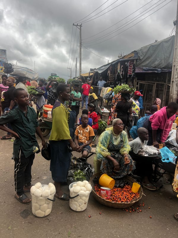 Busy afternoon street life in Nkpor's market district