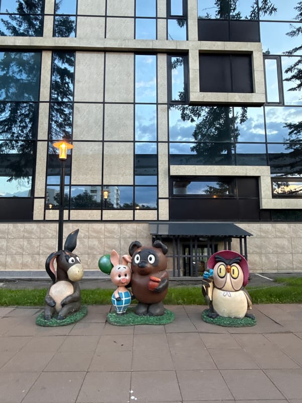 Urban pet encounters and statue spotting during evening stroll